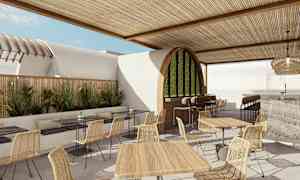 Moderni ulkoilmaravintola, jossa puisia pöytiä ja punottuja tuoleja. (Tekoälyn luoma teksti)