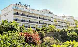 Kerrostalo vehreyden ympäröimänä. (Tekoälyn luoma teksti)