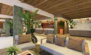 Hotellin aula, jossa on sohvia, koristekasveja ja vastaanotto. (Tekoälyn luoma teksti)