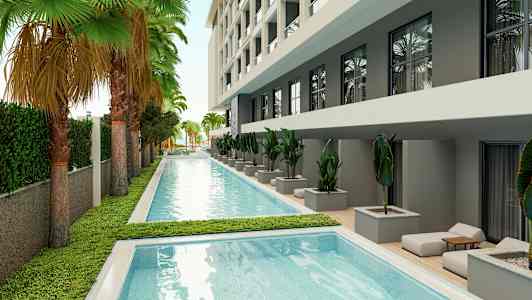 Uima-allas ympäröitynä vihreällä kasvustolla ja modernilla rakennuksella. (Tekoälyn luoma teksti)