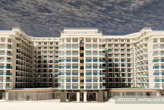 Iso rakennus, jossa on useita kerroksia ja monia parvekkeita, edestä katsottuna. (Tekoälyn luoma teksti)