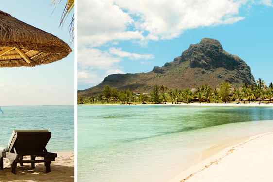 Kaksi aurinkotulia ja aurinkovarjo rantahiekalla, taustalla turkoosi meri.