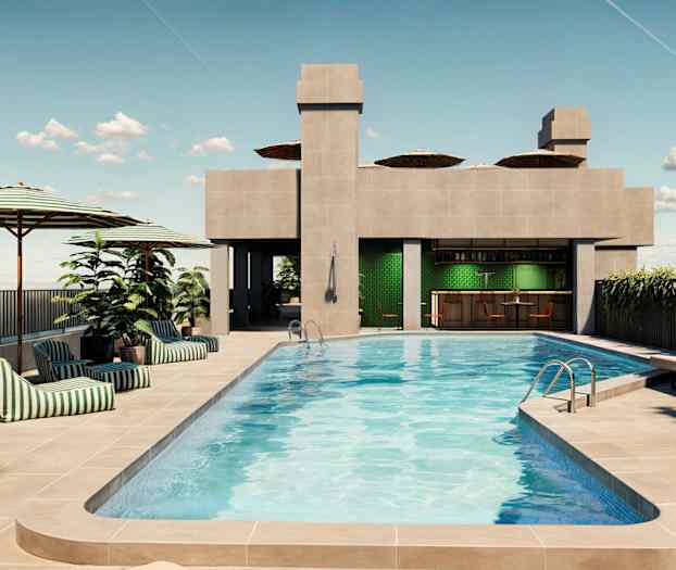 Kuvassa kattoterassin uima-allas, aurinkotuoleja, aurinkovarjoja ja baari. (Tekoälyn luoma teksti)